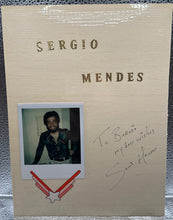 Load image into Gallery viewer, Sergio Mendes & Paul Daneman Dual Signed Album Page w/ Type-1 Polaroid Photo