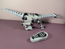 Load image into Gallery viewer, WowWee Roboraptor White & Black Robotic Dinosaur Toy with Remote Control