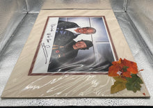 Load image into Gallery viewer, Peter Nygard &amp; George Hamilton Signed Autographed Matted Photo To "Bevins"
