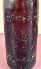 Load image into Gallery viewer, Antique c.1900 McDonach &amp; Shea Winnipeg Embossed Amber Beer Bottle
