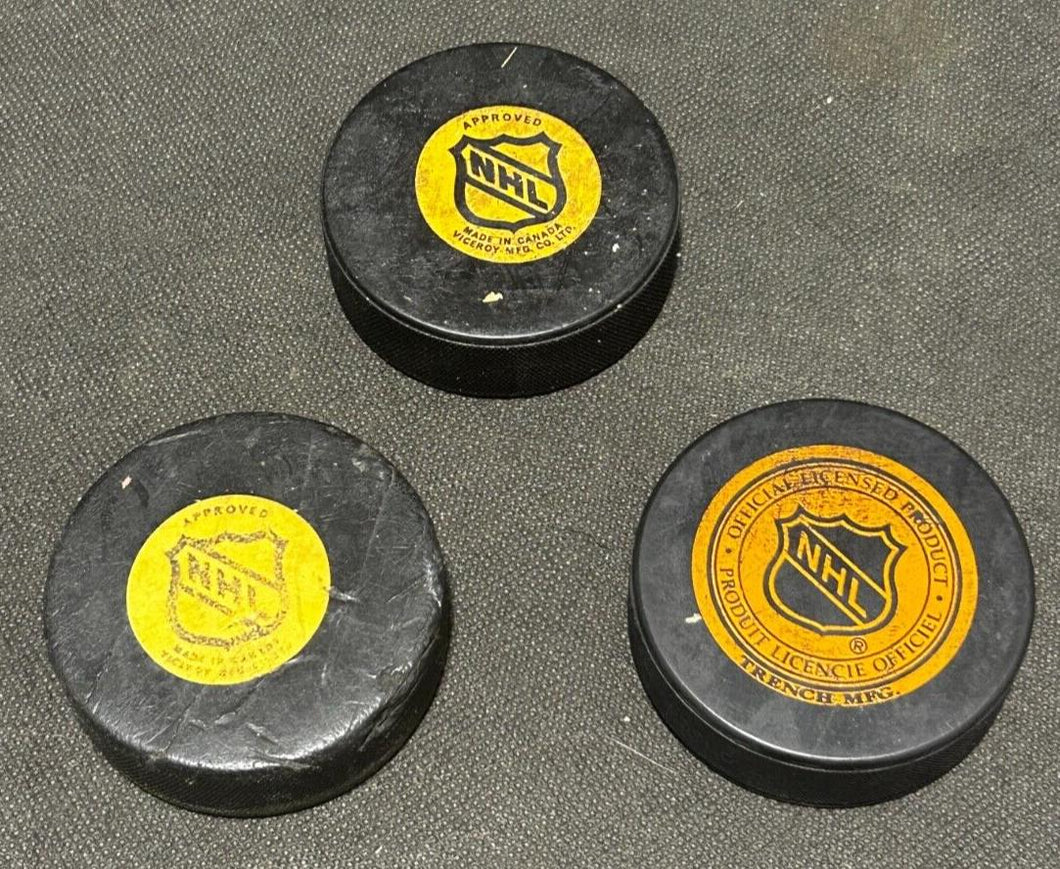 NHL Hockey Viceroy Maple Leaf's 2 game pucks and Trench Maple Leaf's, EX+