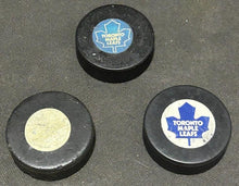 Load image into Gallery viewer, NHL Hockey Viceroy Maple Leaf&#39;s 2 game pucks and Trench Maple Leaf&#39;s, EX+
