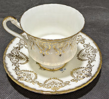 Load image into Gallery viewer, Paragon Tea Cup &amp; Saucer White, Floral &amp; Gold
